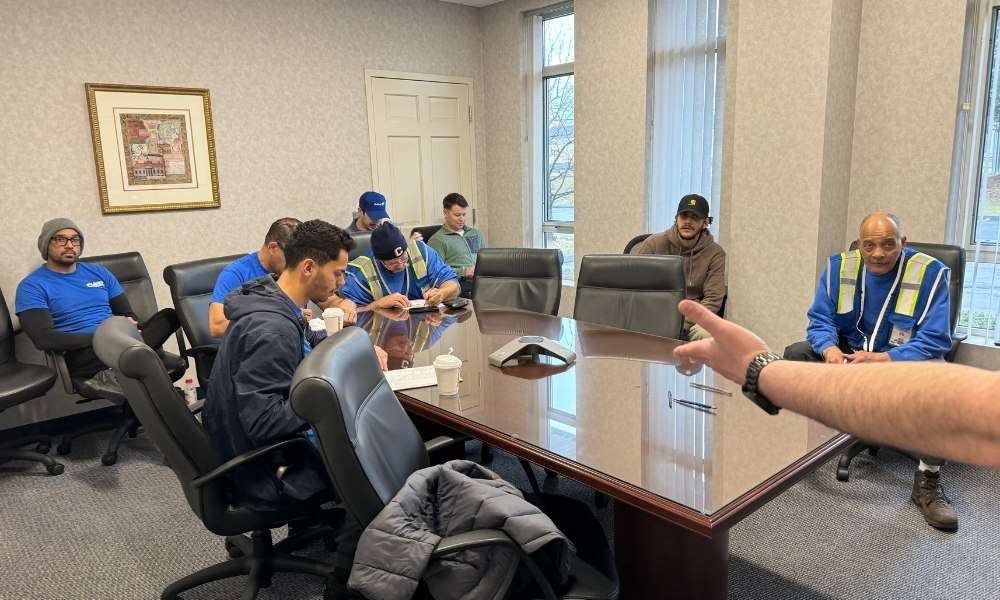 group of workers sitting around a conference table